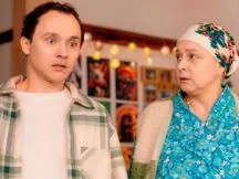 головна